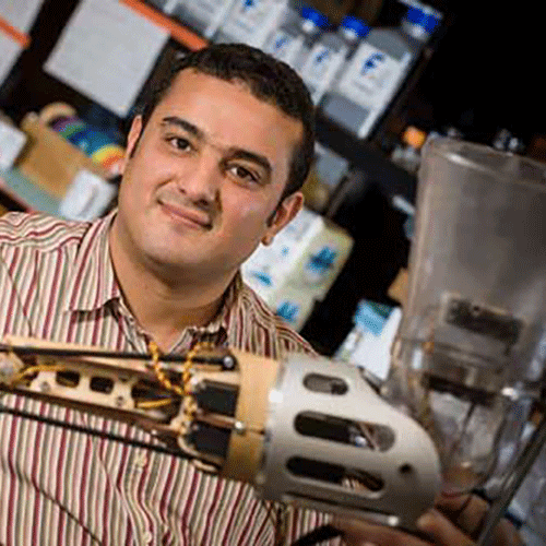 Man posing with prosthetic arm